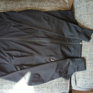 Black long-waisted athletic jacket.